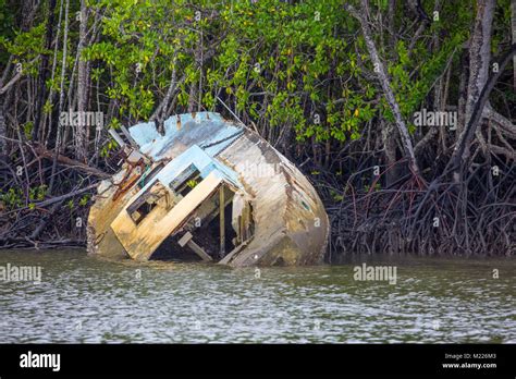 Boat damaged and partially sunk by tropical cyclone Yasi in Port ...