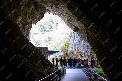 Premium Photo | Cave entrance visitors waiting at the cave entrance