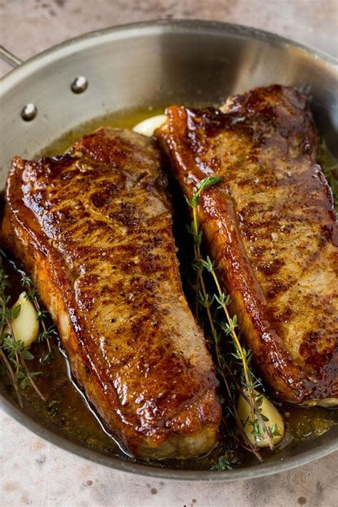 Seared New York strip steak with garlic and herb butter, an easy and ...