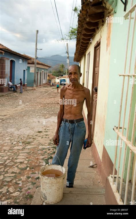 portrait of an old very thin man outside his house in Trinidad Cuba ...