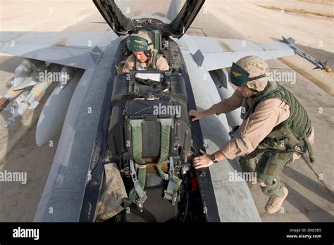 US Marine Corps Aviators Climb Into Cockpit Their F/A-18D Hornet Al ...