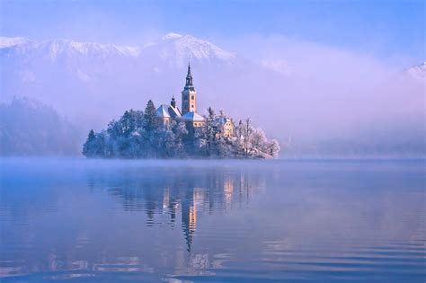 Photo Gallery: Lake Bled draped in winter white in the winter