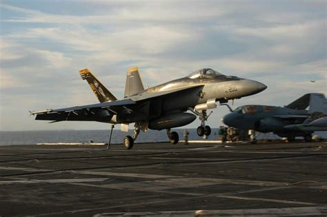 Hook Down! F/A-18E Super Hornet landing over an Aircraft Carrier ...