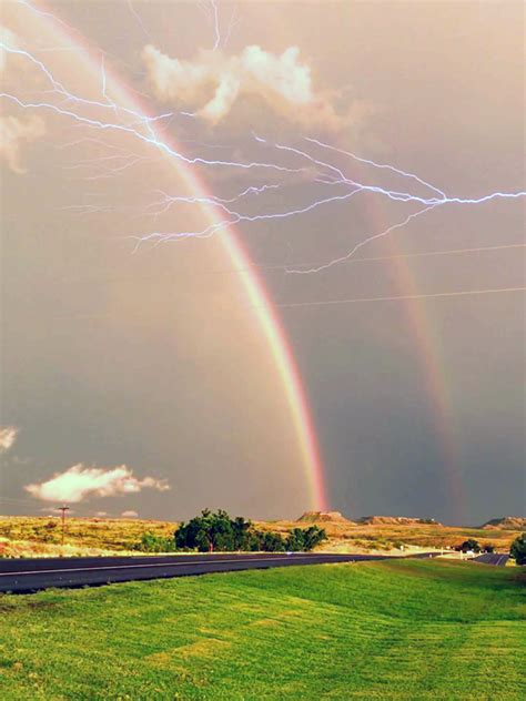 Captivating Double Rainbow and Lightning Strike