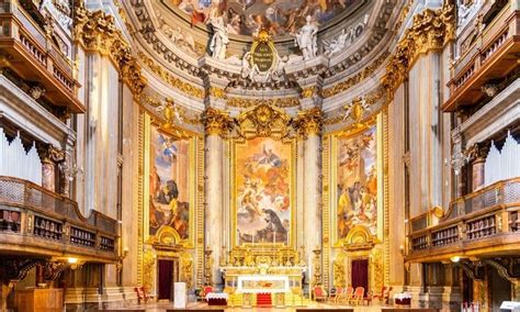 the interior of a large church with high ceilings and paintings on the ...