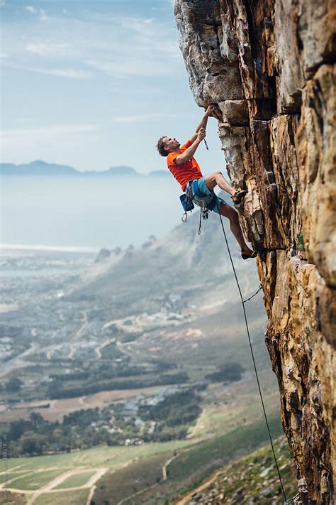 "Mountain Climber Climbing A Mountain Cliff" by Stocksy Contributor ...