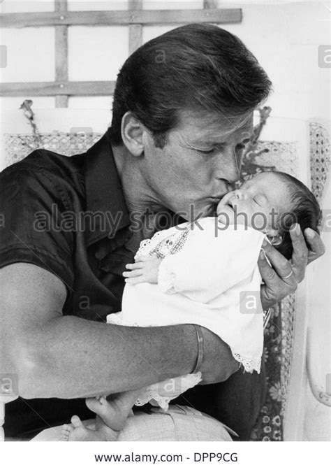 ROGER MOORE WITH HIS NEW BORN SON CHRISTIAN. TAKEN BY DAVID MICHAEL IN ...