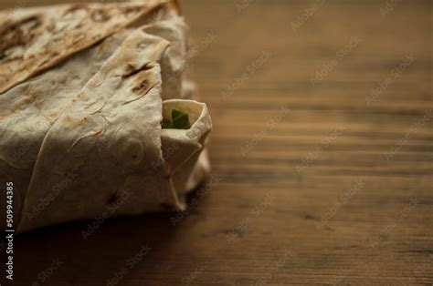 Shawarma wrap sandwich on white wood table arabic food sauce Stock ...