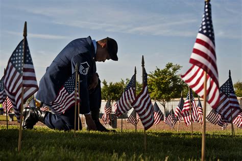 Airmen place flags at the Southern Nevada Veterans Memorial Cemetery