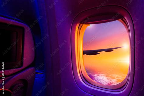 Beautiful scenic view of sunset through the aircraft window. Image save ...