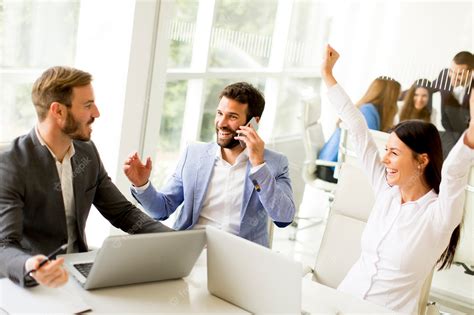 Premium Photo | Group of happy business people in a meeting at office