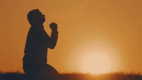 Young Man Praying At Sunset Seeking Solace Stock Footage SBV-334775192 ...