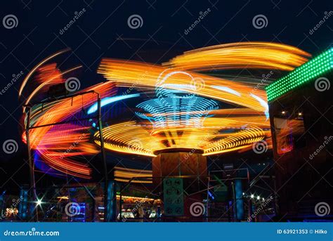 Carousels at night stock image. Image of blur, colorful - 63921353