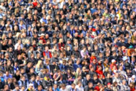 Blurred crowd of spectators on a stadium tribune at a sporting event ...