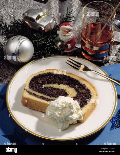 Slice of poppy seed cake Stock Photo - Alamy