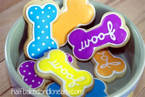 Dog bone decorated sugar cookies for humans. Royal icing. Purple, blue ...