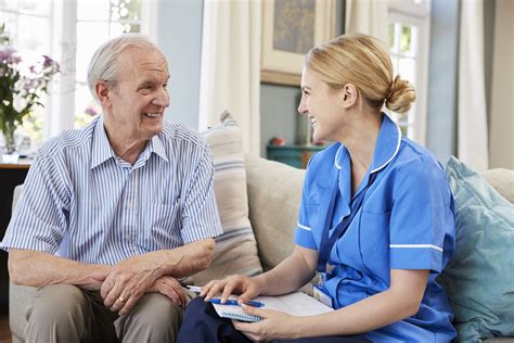 Female Community Nurse Visits Senior Man At Home - Care Management Matters