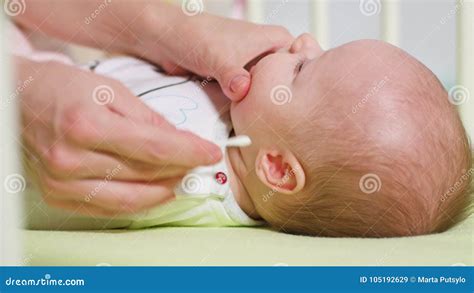 Mother is Cleaning Her Baby Ears Stock Image - Image of adorable ...