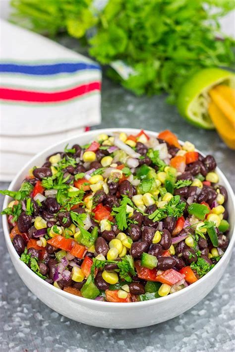 a white bowl filled with black beans and veggies