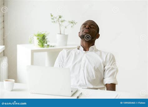 Black Employee Taking Rest Doing Exercise for Relaxation at Work Stock ...