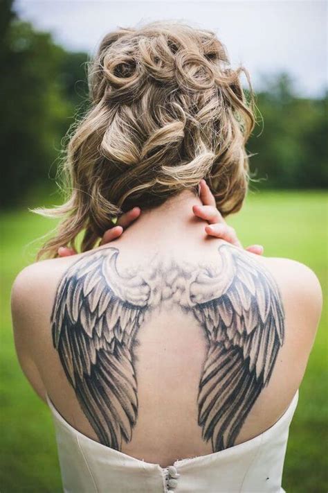 Update 81+ woman angel wings tattoo best - mncb.edu.vn