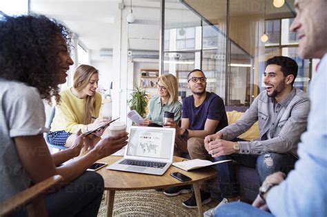 Happy business people discussing in meeting at office stock photo