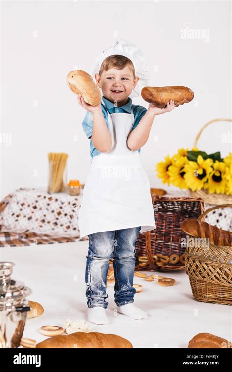 Boy chef cooking in the kitchen Stock Photo - Alamy