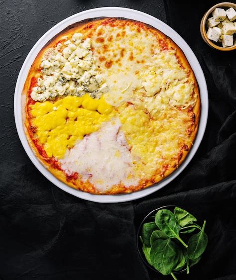 Premium Photo | Different types of cheese on a big pizza