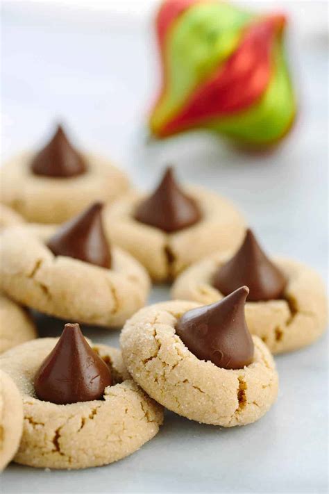 when do you put the hershey kisses on peanut butter cookies