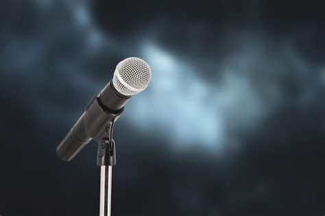 Premium Photo | Microphone with stage light background for performance ...