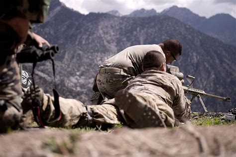 A U.S. Army sniper team set up a rifle during a mission - NARA & DVIDS ...