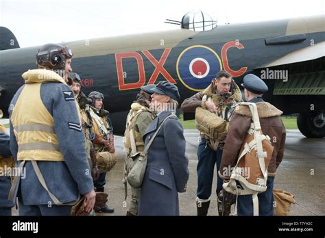 Avro Lancaster bomber crew on Airfield Stock Photo - Alamy