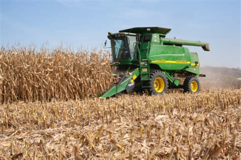 Farmer In A John Deere Combine Harvesting Corn Stock Photo - Download ...