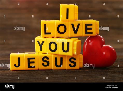 I LOVE JESUS sign illustrated with yellow plastic letters on wooden ...