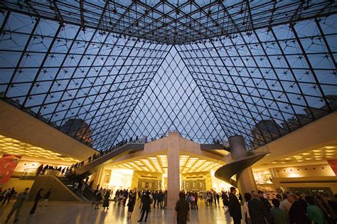 Looking up the large glass pyramid inside the Louvre