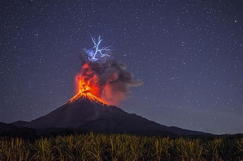 Incredible image captures the exact second lightning struck an erupting ...