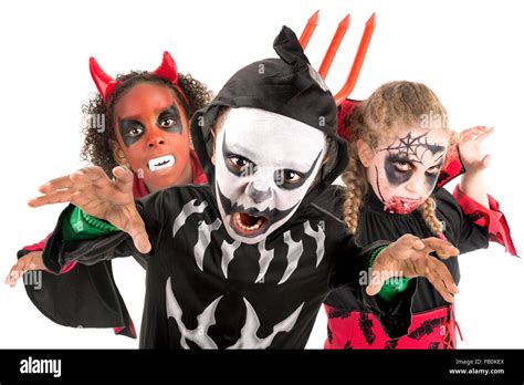 Group of kids with face-paint and Halloween costumes Stock Photo - Alamy