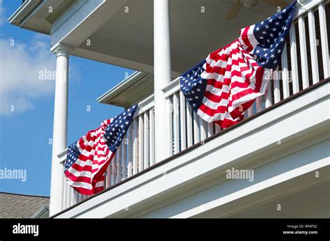 Patriotic American Flag Bunting Hung on a Brick House with a White ...