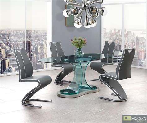 Zues Modern Bent Glass Oval Dining Table with grey chairs