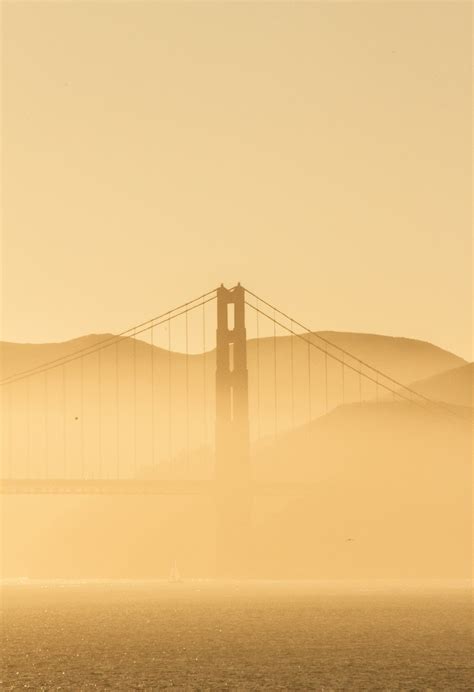 Golden gate bridge covered with fog photo – Free Mountain Image on Unsplash