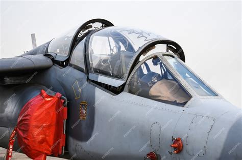 Premium Photo | Cockpit of military fighter jet parked in the airforce.