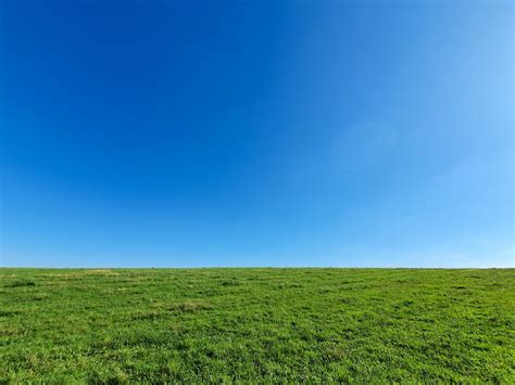 Blue Sky And Green Grass Background