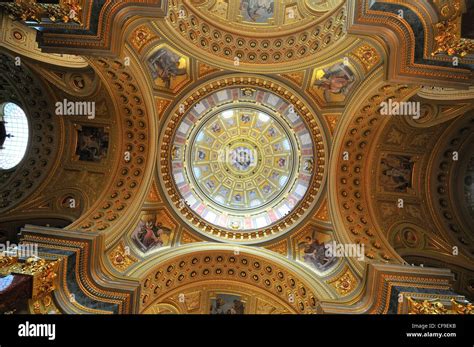 Looking up at the ornate golden dome in the interior of the Roman ...