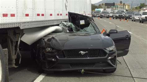 Watch Workers Pull Out A Mustang Wedged Under Big Rig After Horrific ...