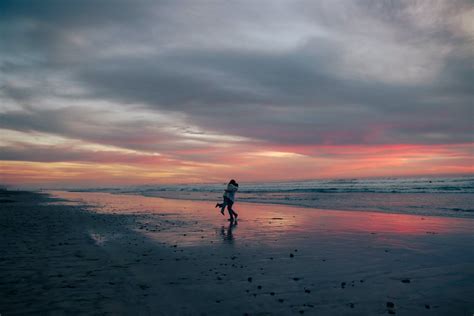 A Silhouette of a Couple on the Beach · Free Stock Photo