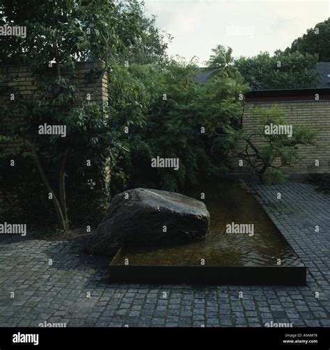 Modern Styled Garden with Water Feature Stock Photo - Alamy