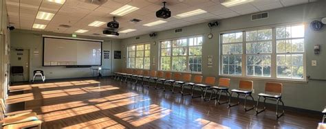 Premium Photo | An Empty Classroom With Desks And A Whiteboard Wallpaper