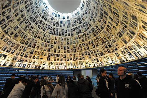 Tourists visit the Hall of Names in the Yad Vashem Holocaust Museum in ...