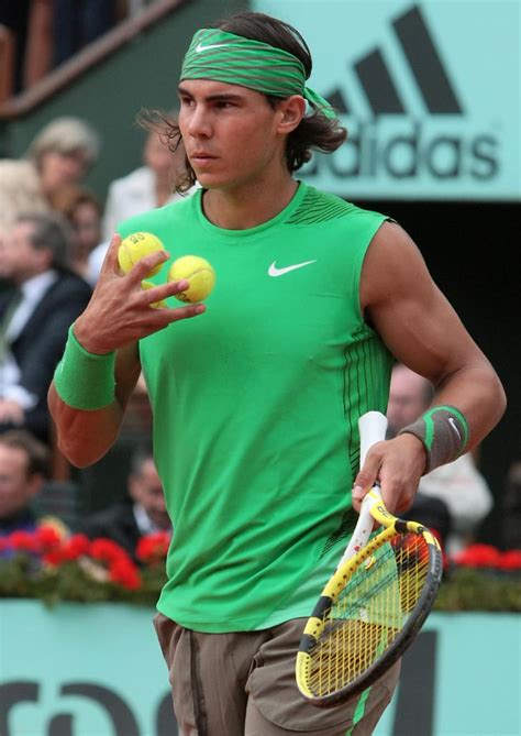 Rafael Nadal sported his signature head and wrist band in his | Iconic ...