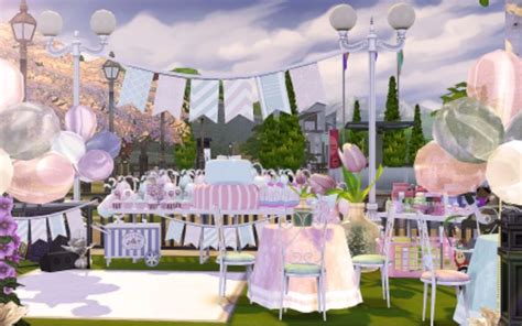 an outdoor party with balloons, tables and chairs